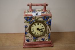 A 19th Century French porcelain enamelled mantel clock, decorated with a foliate design, and
