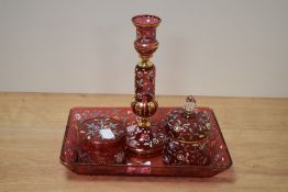 A 20th Century continental red glass dressing table set, with hand painted floral decoration, and to
