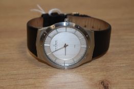 A gents Skagen wristwatch with leather strap.