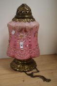 A late 19th/early 20th Century glass ceiling light fitting, having a moulded pink glass shade,