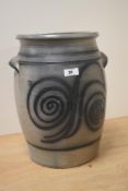 A decorative 20th Century stoneware slop pail, the moulded rim above a spiralled design, with two