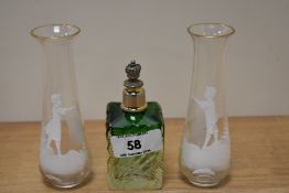 A pair of enamelled clear glass vases, of Mary Gregory style, together with a vintage green glass