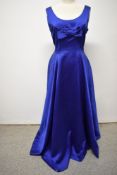 A 1950s electric blue satin evening gown, having full skirt and bow to bust.