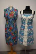 Two 1950s/ 1960s sundresses, including novelty fruit print bark cloth dress with pique cotton straps