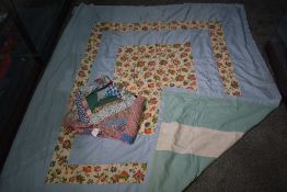 A vintage unfinished / unbacked patchwork coverlet, using bright floral and patterned fabric (
