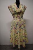 A late 1940s/ early 1950s two piece cotton sun dress and bolero,having abstract feather pattern in