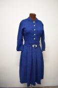 A 1940s / 1950s blue plaid woollen day dress, having side metal zip, buttons to front and belt to