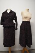 A 1950s three piece skirt suit, comprising of jacket, pleated skirt and pencil skirt, having