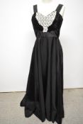 A 1950s black taffeta evening gown, having lace and velvet detail to bodice, rear metal zip, full