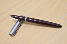 A Parker 51 Vacumatic plunger fill fountain pen in cordovan brown having a lustraloy cap.