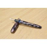 A Conway Stewart 84 lever fill fountain pen in rose marble with single broad band to cap having