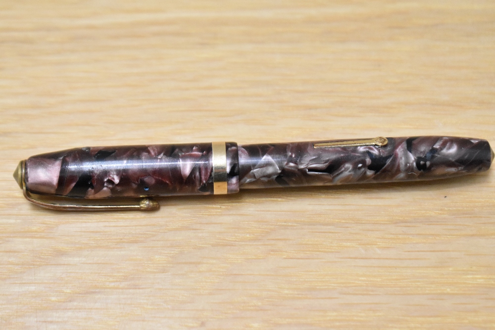 A Conway Stewart 84 lever fill fountain pen in rose marble with single broad band to cap having - Image 2 of 3