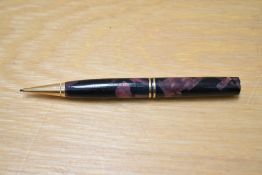 A Parker Duofold propelling pencil in burgundy and black marble. Missing top and engraved