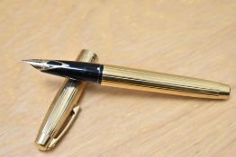 A boxed Sheaffer Imperial 777 aerometric fill fountain pen. Gold plated with white spot having a