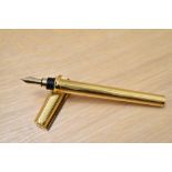 A boxed S T Dupont Montparnasse converter fountain pen gold plated reeded design having 18k Dupont