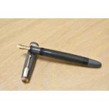 A Parker Duofold button fill (aluminium) fountain pen in grey with decorative band to the cap having