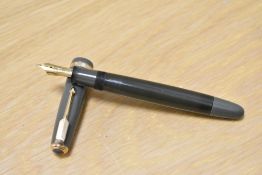 A Parker Duofold button fill (aluminium) fountain pen in grey with decorative band to the cap having