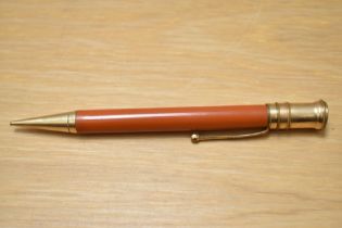 A Parker Duofold propelling pencil in red