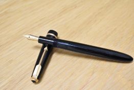 A Parker Slimfold aero fill fountain pen in black with a narrow decorative band to the cap having
