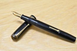 A Conway Stewart 55 lever fill fountain pen in black with single broad and two narrow bands to the