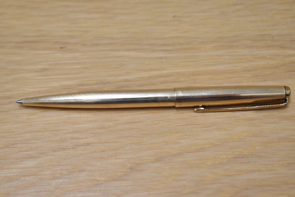 A Parker 65 Insignia ballpoint pen in gold fill. Engraved