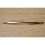 A Parker 65 Insignia ballpoint pen in gold fill. Engraved