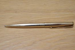 A Parker 65 Insignia ballpoint pen in gold fill. Engraved