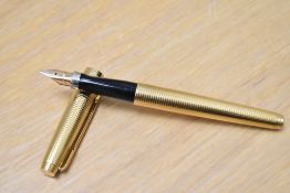 A Parker 75 converter fill fountain pen in Tiffany Grid 14K gold fill having a Parker 14k USA nib