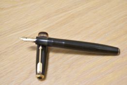 A Parker Duofold button fill fountain pen in chocolate brown with decorative band to the cap