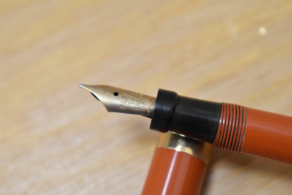 A Parker Lady Duofold Lucky Curve button fill fountain pen in red with broad band to a ring cap - Image 2 of 4