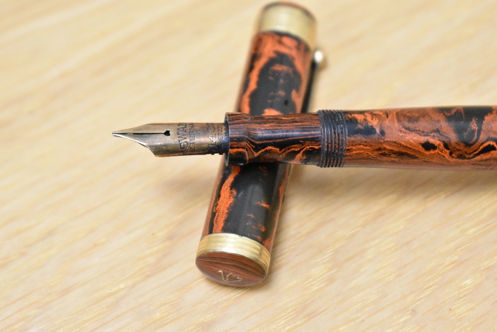 A Mabie Todd Swan Eternal lever fill fountain pen in red black HR with broad band to base of the cap - Image 2 of 3