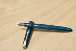 A Parker Slimfold aero fill fountain pen in green with narrow decorative band to the cap having