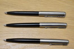Three Parker ballpoint pens in black with lustraloy caps