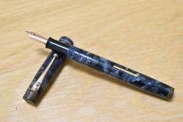 A De La Rue Onoto 1332.A6 lever fill fountain pen in blue/black marble with two narrow bands to