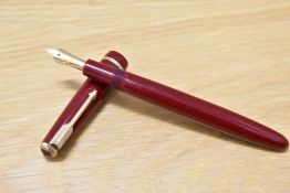 A Parker Duofold Junior aerometric fill fountain pen in red with narrow decorative band having