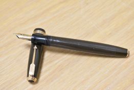 A Parker Duofold button fill fountain pen in chocolate brown with decorative band to the cap