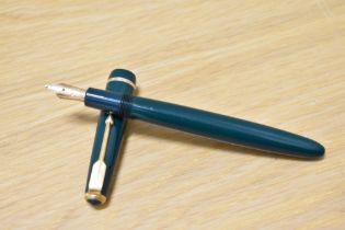 A Parker Duofold Junior in green with decorative band to the cap having Parker 14k 585 England 10