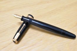 A Parker Duofold button fill (aluminium) fountain pen in black with decorative band to the cap