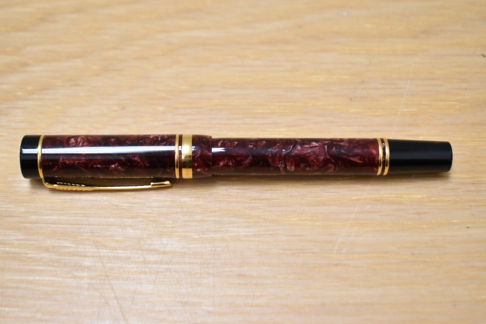 A Parker Duofold International Cartridge fill fountain pen in red swirl with one broad and one - Image 3 of 3