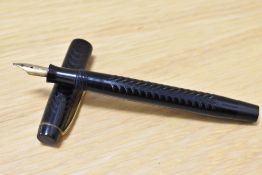 A Parker Ladys button fill fountain pen in black chaised design having warrented 14ct 1st quality