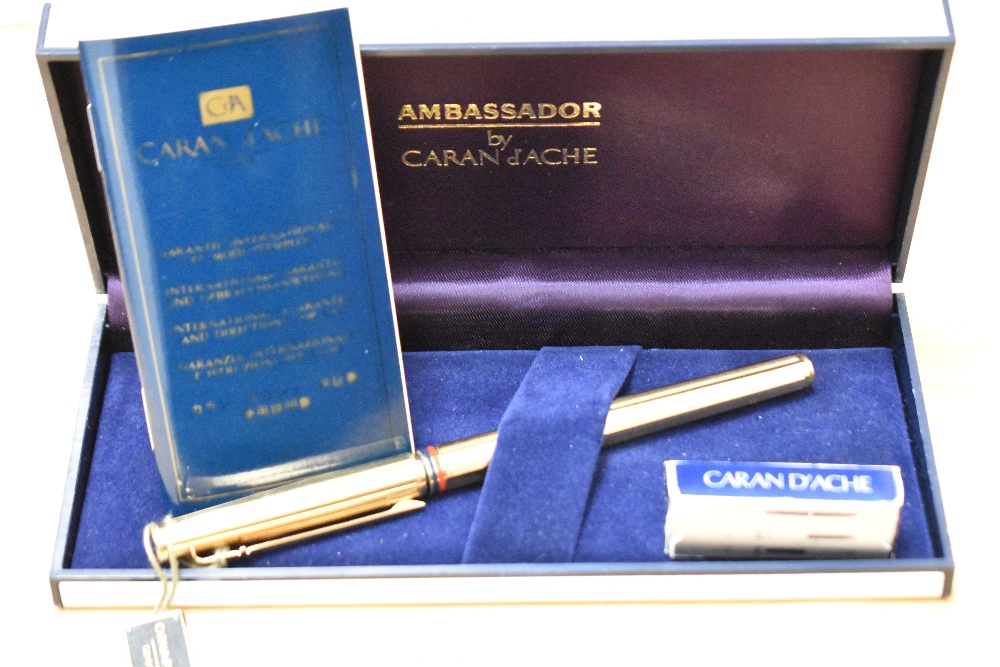 A boxed Caran d'Ache Ambassador converter/ cartridge fill fountain pen, gold plated with red and - Image 3 of 3