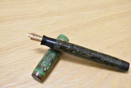 A Parker Duofold Senior Slimline button fill fountain pen in jade green with two narrow bands to the