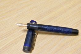 A Parker Duofold Junior button fill fountain pen in lapis blue with white fleck with two narrow