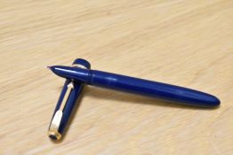 A Parker Duofold Lady aero fill fountain pen in blue with narrow decorative band to the cap