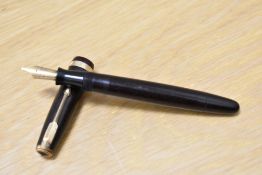 A Parker Duofold button fill fountain pen in chocolate brown with decorative band to the cap