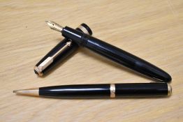 A Parker Duofold aerofill fountain pen and propelling pencil set in black with decorative broad band