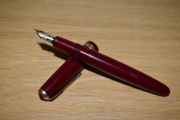 A Parker Duofold Standard Aerometric fill fountain pen in red with decorative band to the cap having