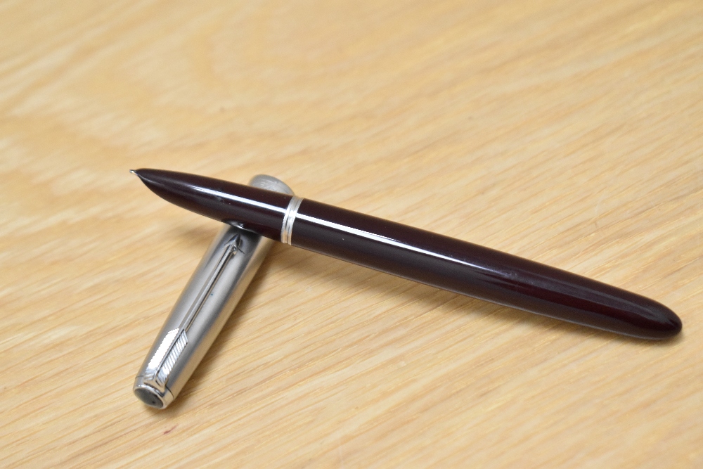 A Parker 51 MK2 aerometric fill fountain pen in burgundy having a lustraloy cap