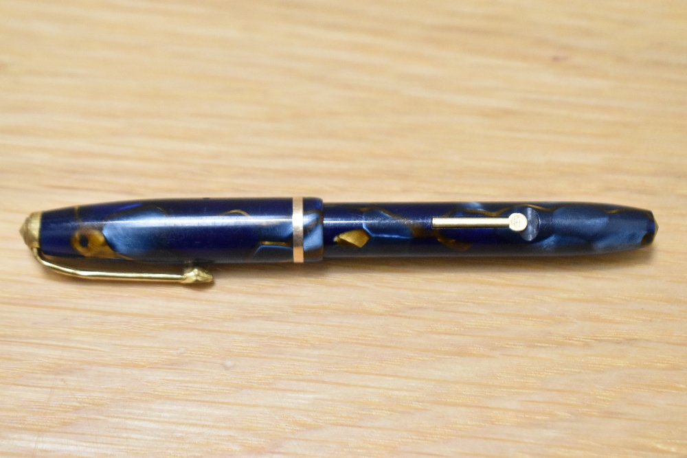 A Conway Stewart Dinkie 550 lever fill fountain pen in Blur/bronze marble with single band to the - Image 3 of 3