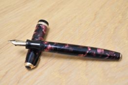 A Parker Duofold Standard button fill fountain pen in burgundy/black marble with decorative band